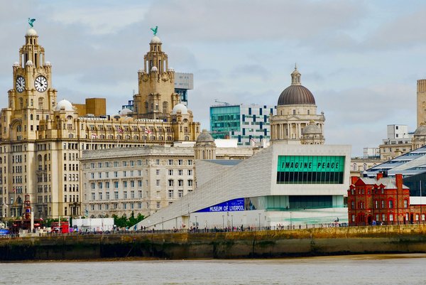 How can you arrange a guided tour focusing on the architectural marvels of Liverpool?